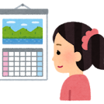 カレンダーを見る女性
